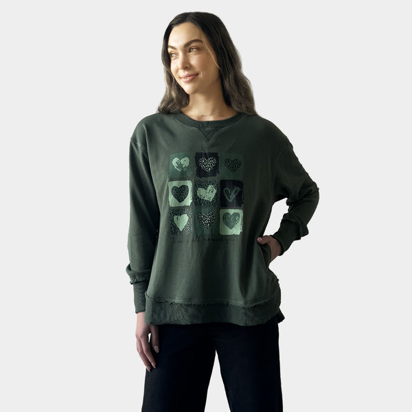 AM24026  MULTI PRINT SIDE POCKET SWEATSHIRT